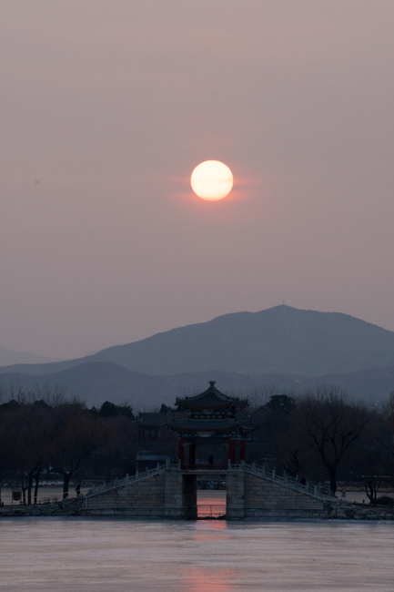 Sunset over a pavilion at the Summer Palace during a half-day boat tour
