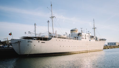 A large white ship docked at a dock