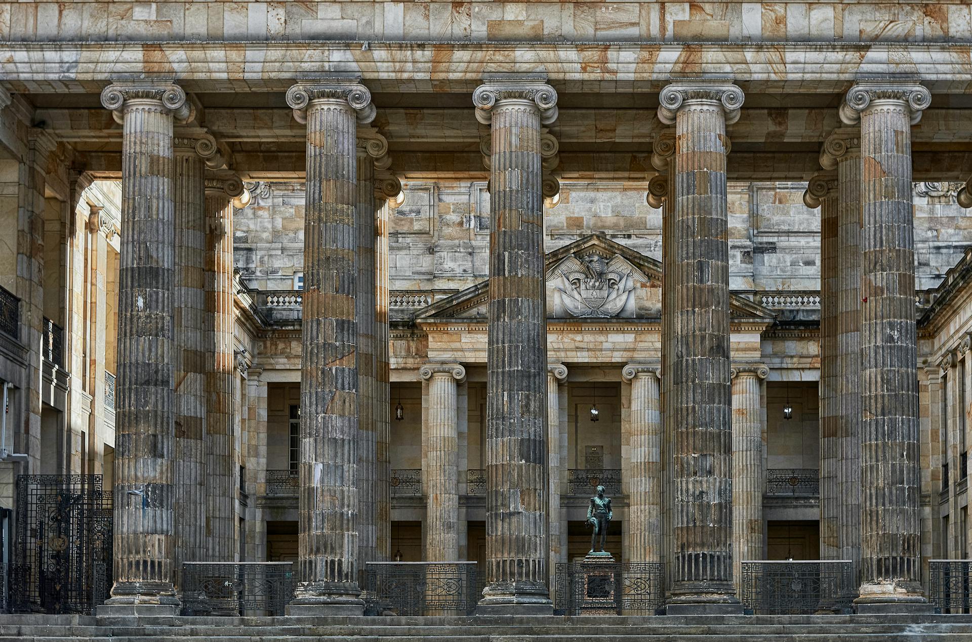 Stunning view of Bolivar Square's Capitolio Nacional with its neoclassical columns in Bogotá, Colombia.