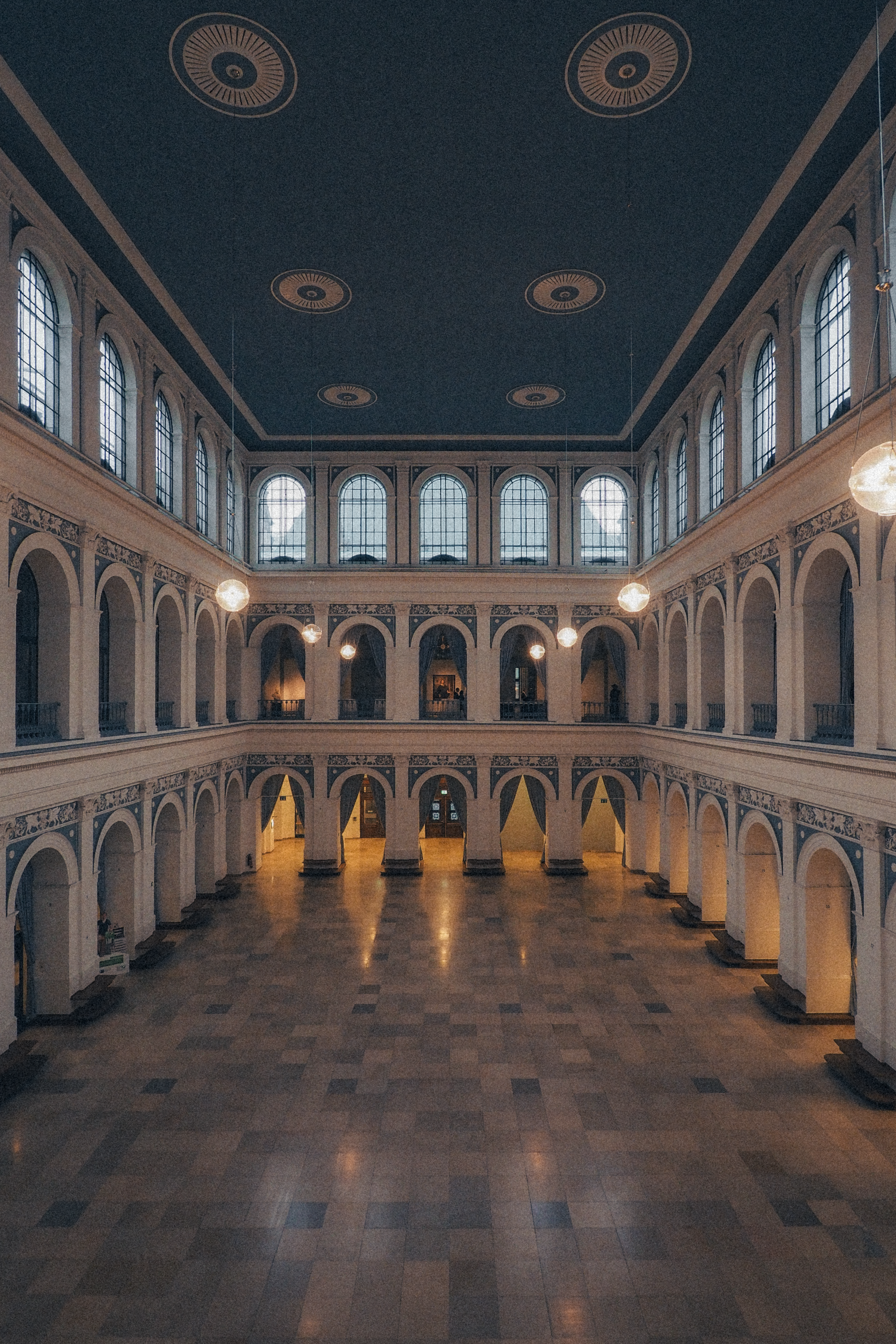 Discover the architectural elegance of the Hamburg Chamber of Commerce's historic interior in this vertical shot.