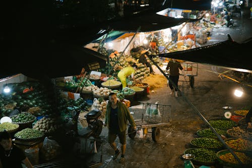 A night scene of people at a market