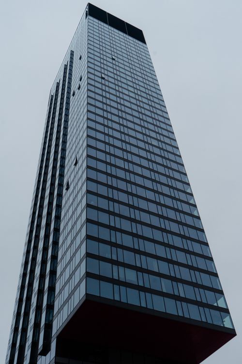 Free A towering skyscraper in Warsaw, Poland showcasing modern architecture against a cloudy sky. Stock Photo