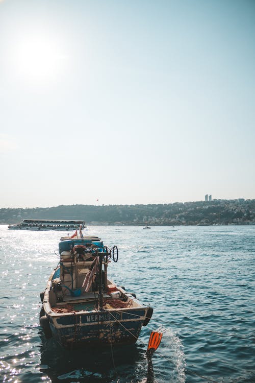 White Sailing Boat on Body of Water