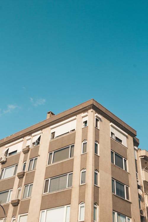 Free Modern apartment building against cloudless sky Stock Photo