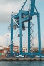 Blue shipboard crane in industrial port