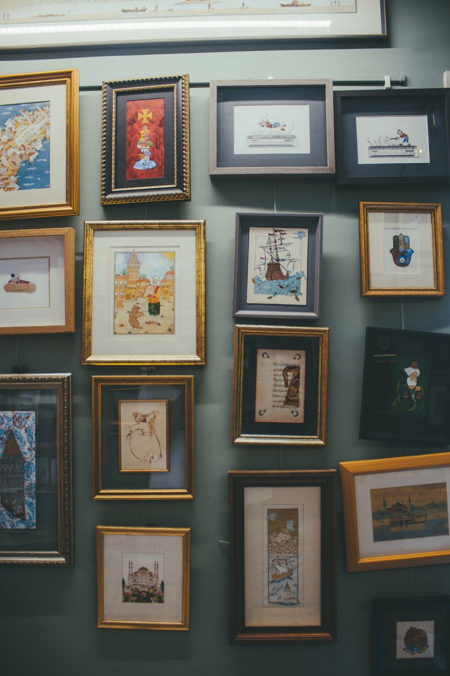 A salon-style gallery wall of framed art