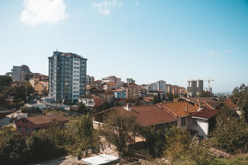 Free A scenic urban cityscape with modern and traditional buildings under a clear sky. Stock Photo