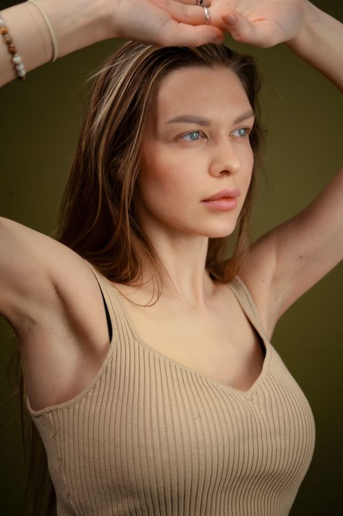 A Woman with her Arms Raised · Free Stock Photo