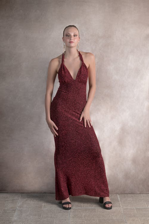 Standing Woman in Red Halter Dress