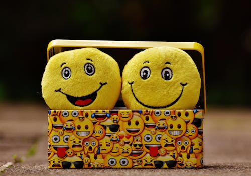 Free Two Yellow Emoji on Yellow Case Stock Photo