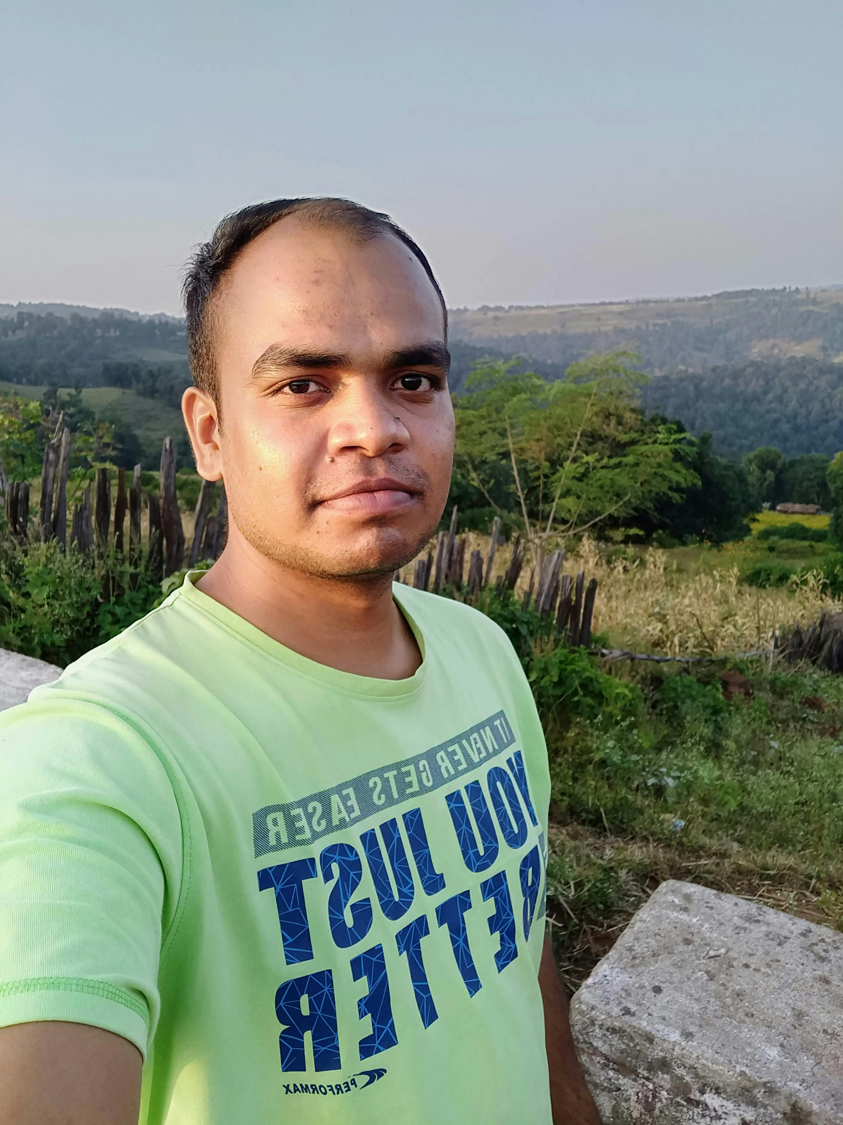 Homeowner cleaning vinyl siding for maintenance