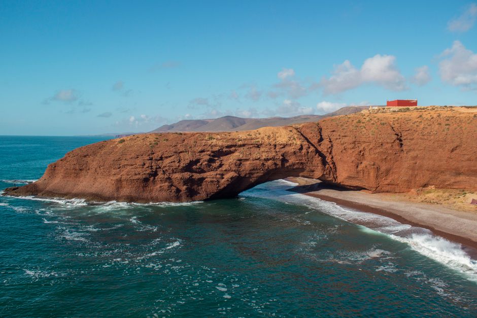 Stunning view of the natural arch at Legzira Beach, Morocco's vibrant coastline.