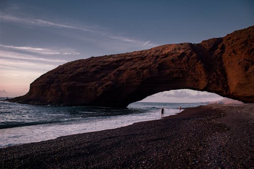 Natural Arch over Lagzira Beach in Morocco