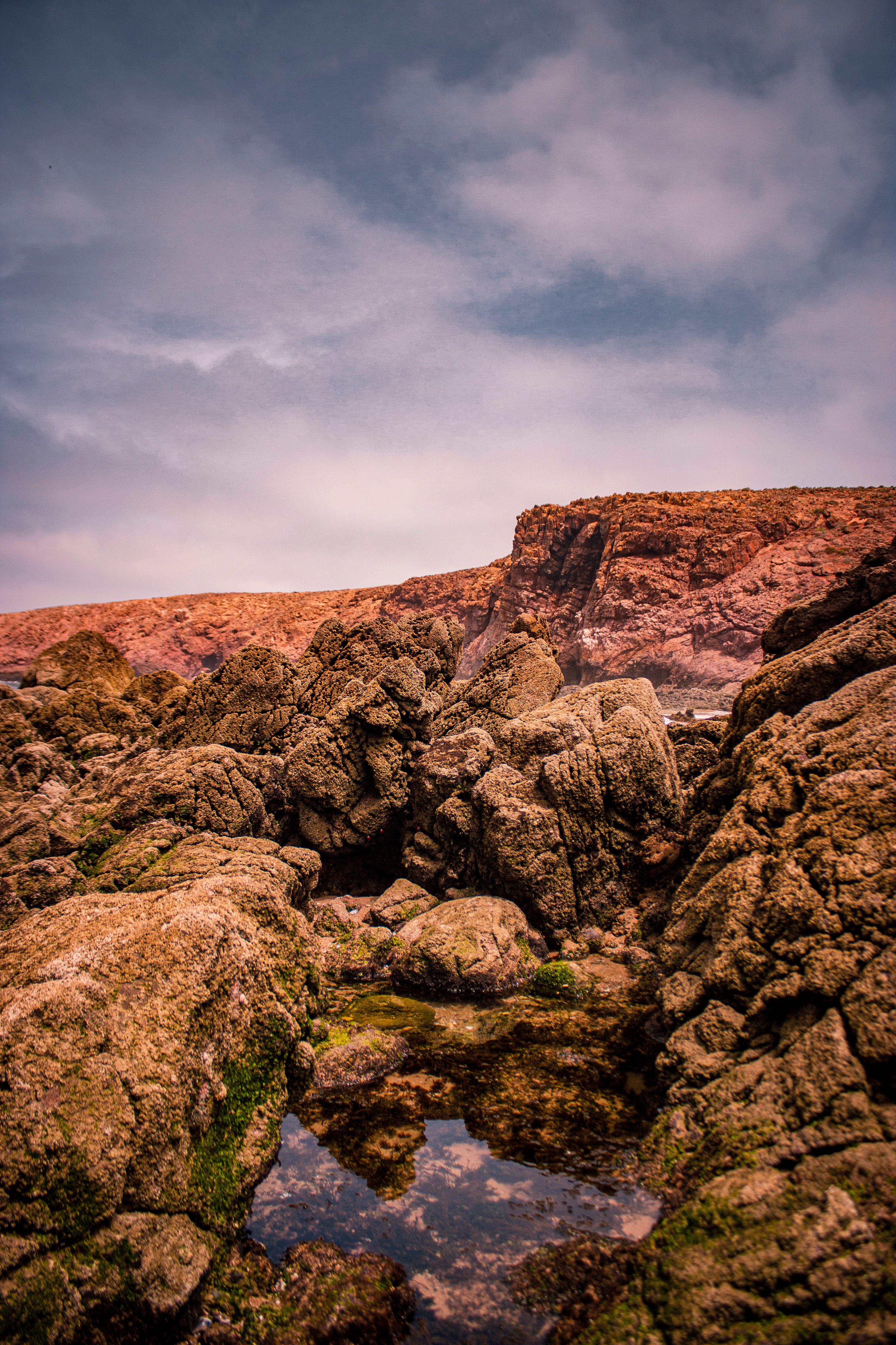 Water Puddle among Barren Rocks · Free Stock Photo