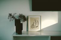 Drawing in Frame and Plants in Vases on Table