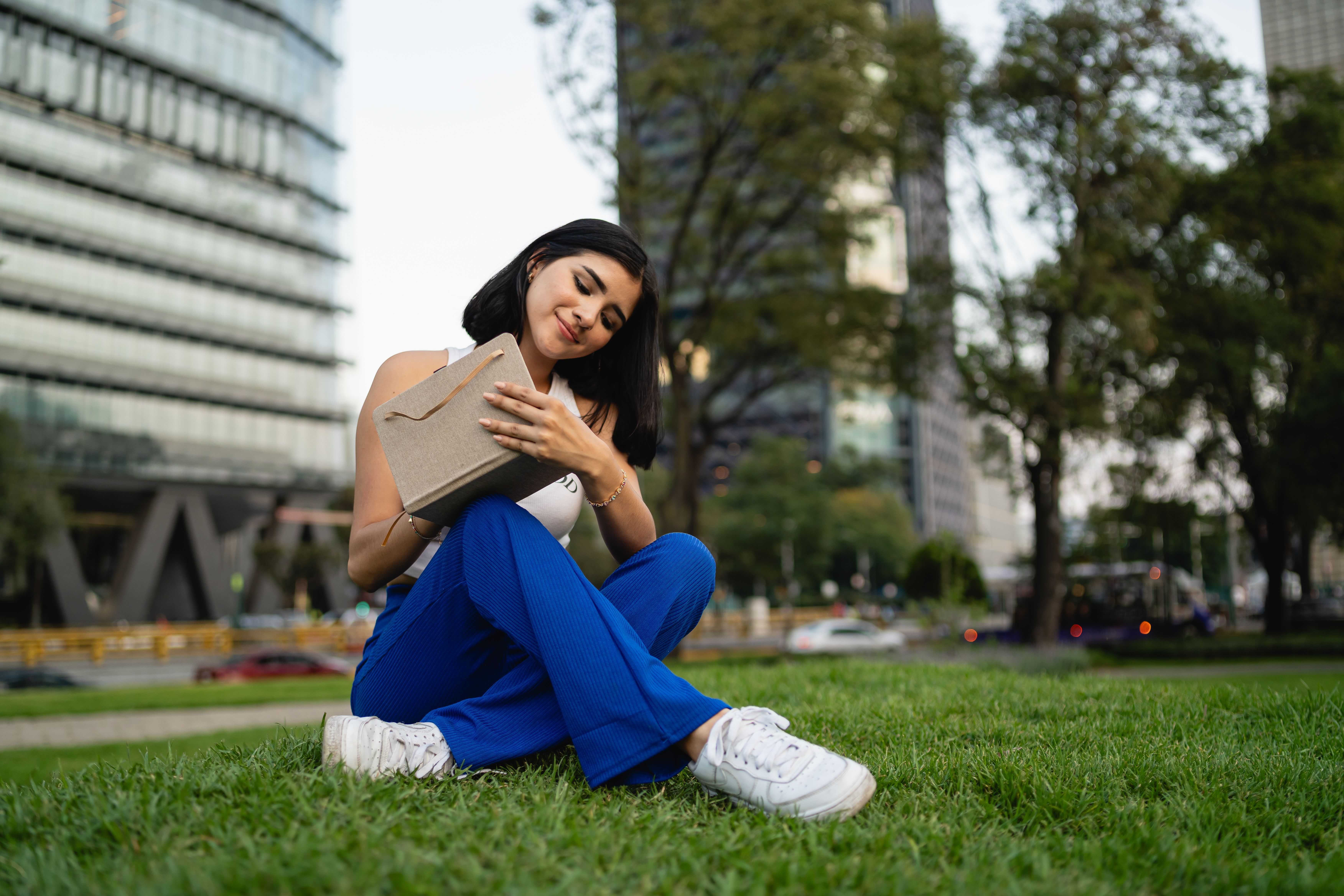 A Woman Sitting on the Ground · Free Stock Photo
