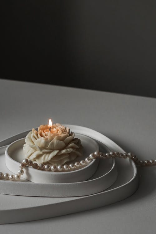 Burning Candle and Pearls 