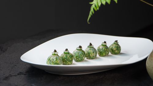 Free Exquisite gourmet dish artistically presented on a sleek white plate, perfect for culinary themes. Stock Photo