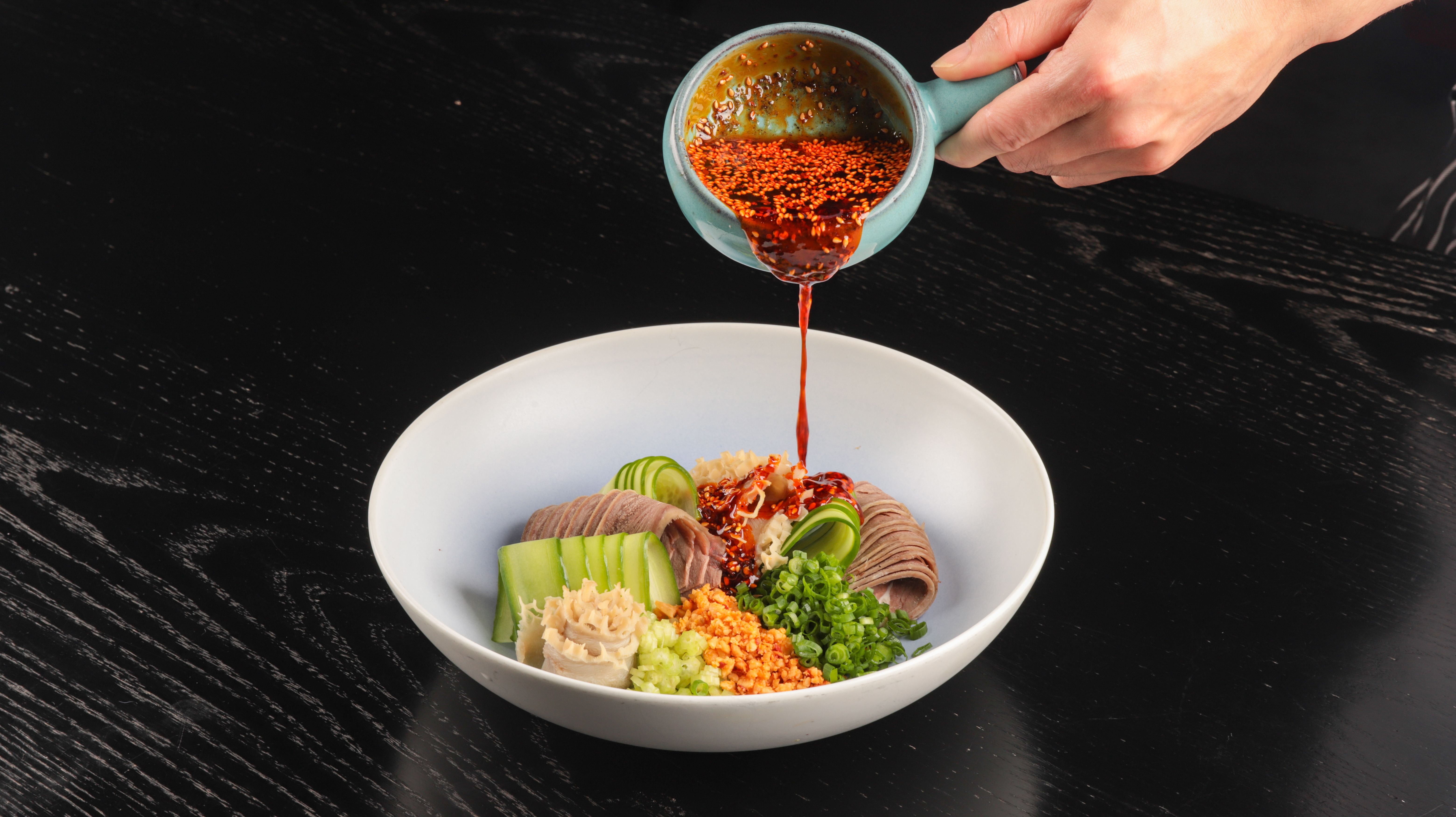 Stir in chili oil or hot sauce