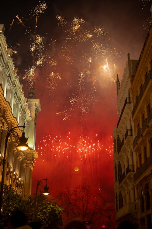 View of Fireworks above Buildings in a City 