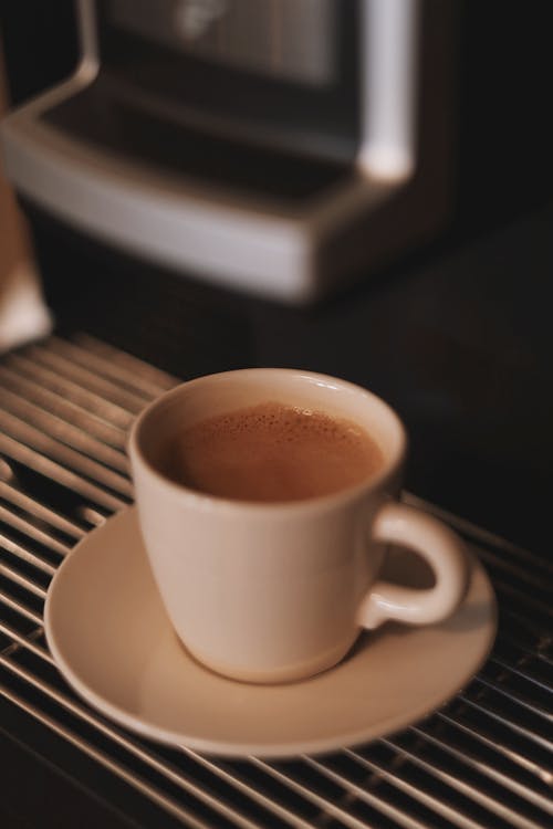 Free A cup of coffee is sitting on a saucer Stock Photo