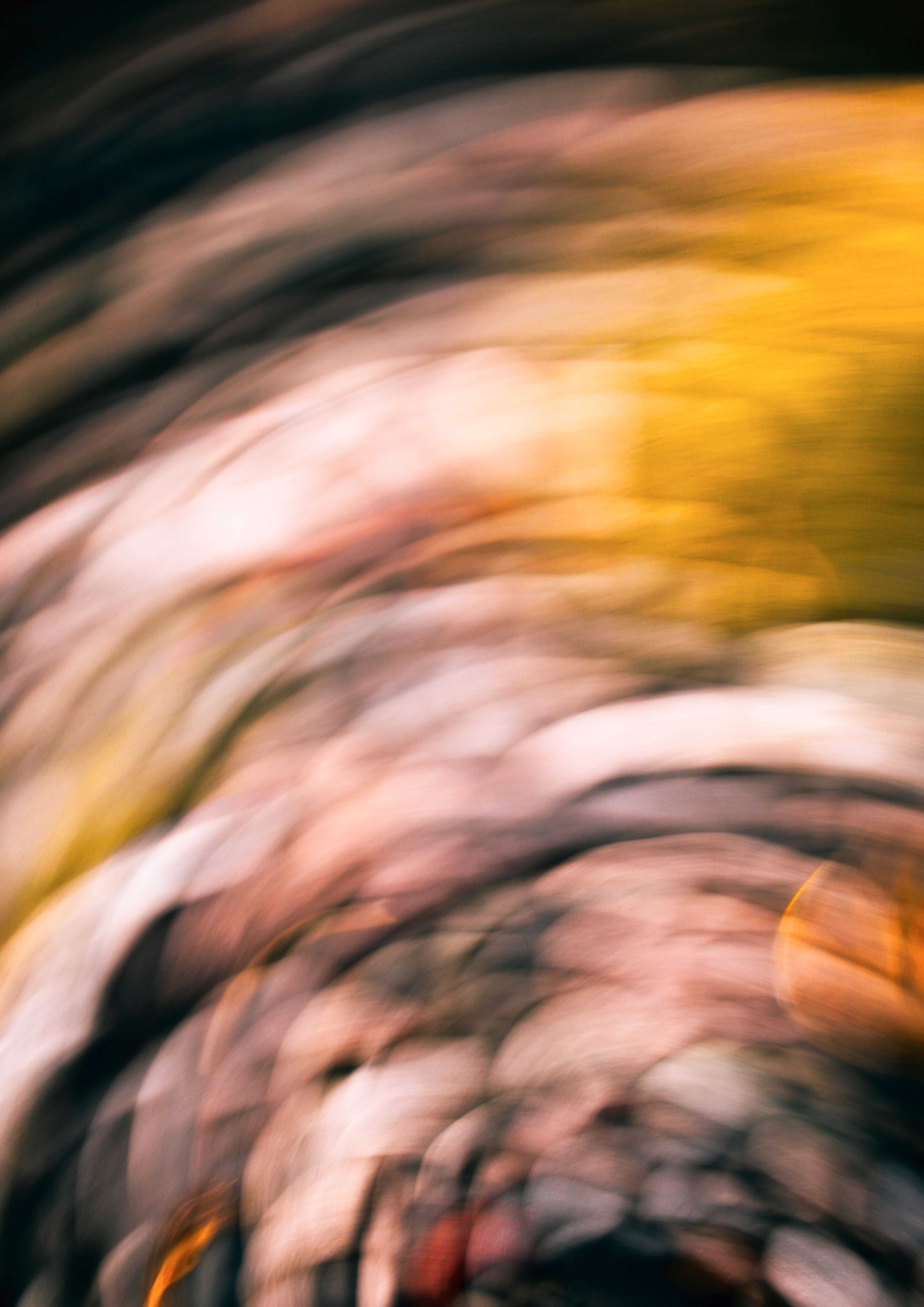 Dreamy abstract swirl capturing ethereal stone textures with fluid motion and warm tones.