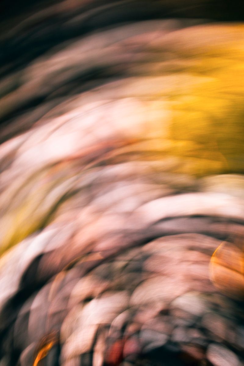 Dreamy abstract swirl capturing ethereal stone textures with fluid motion and warm tones.