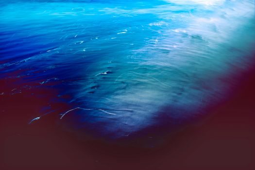 Abstract image of ocean water with ethereal light and shimmering textures, creating a serene and tranquil feel.