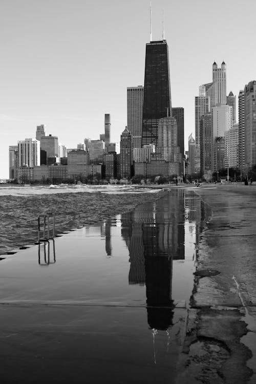 Black and white photo of chicago skyline with reflection