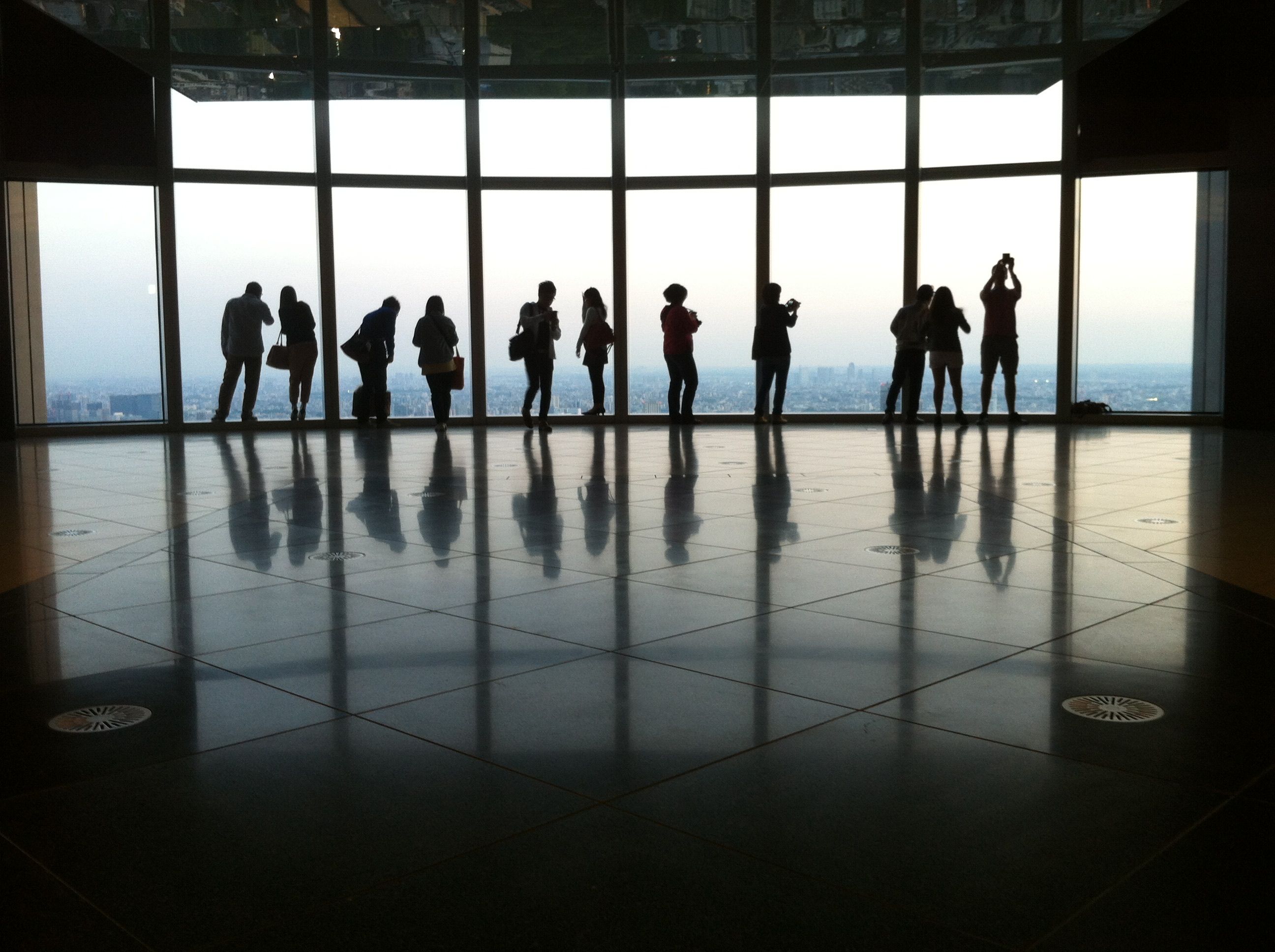 Silhouette of People in Front of a Window · Free Stock Photo