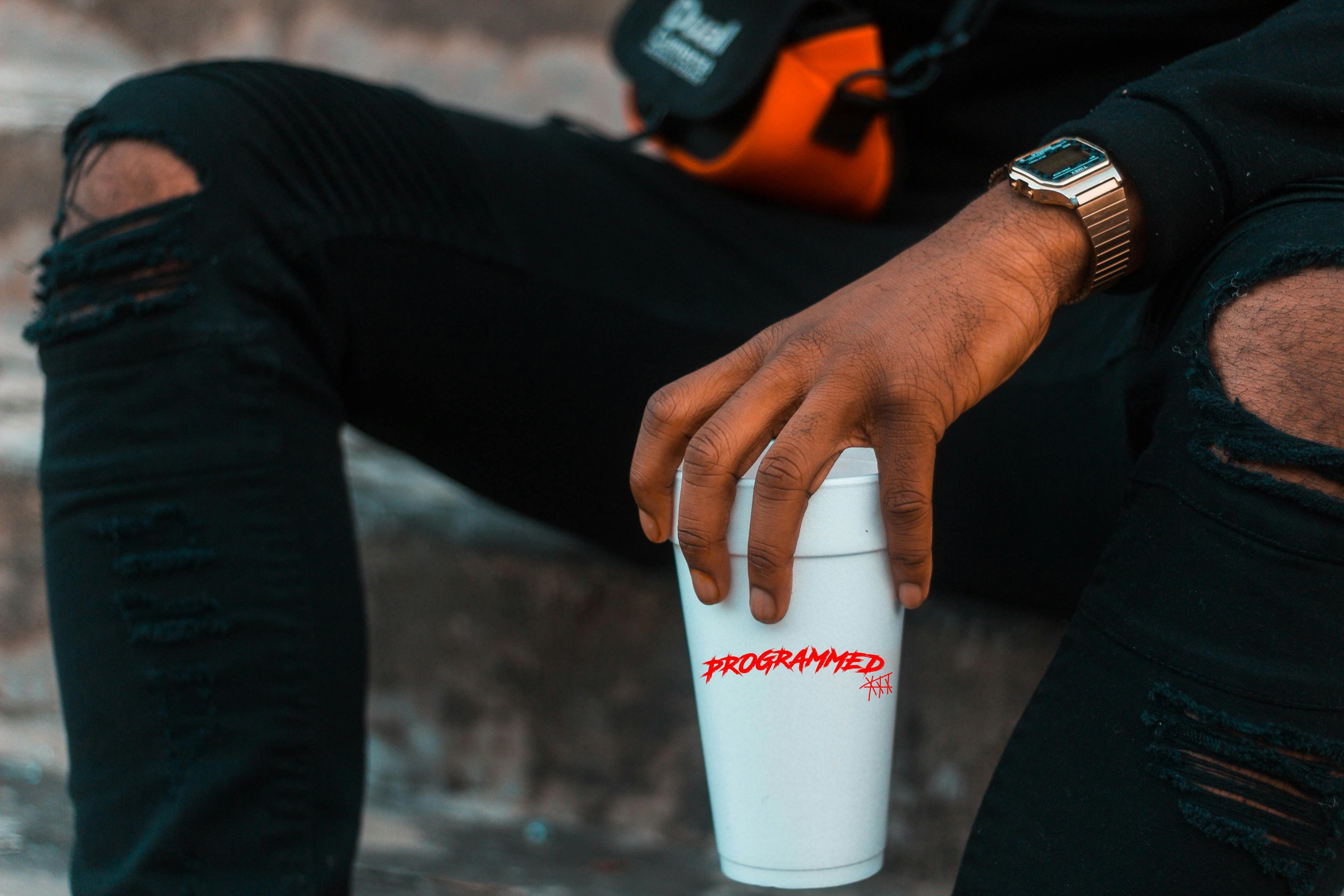 Man Holding Disposable Drinking Cup on Left Hand · Free Stock Photo