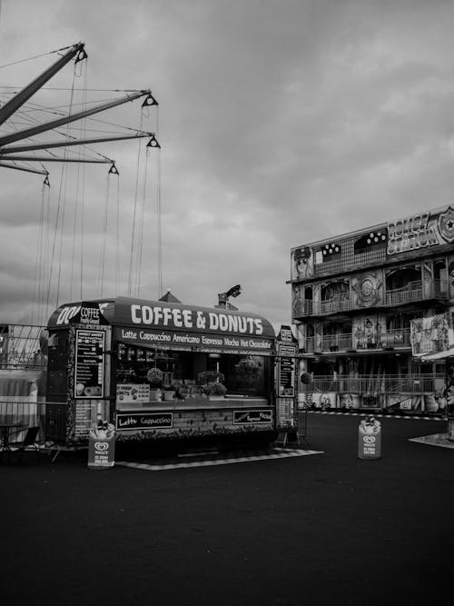 A black and white photo of a coffee stand