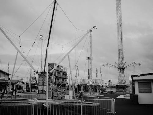 Black and white photo of carnival rides at the fair