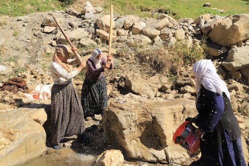 Aunties washing their wool in the stream