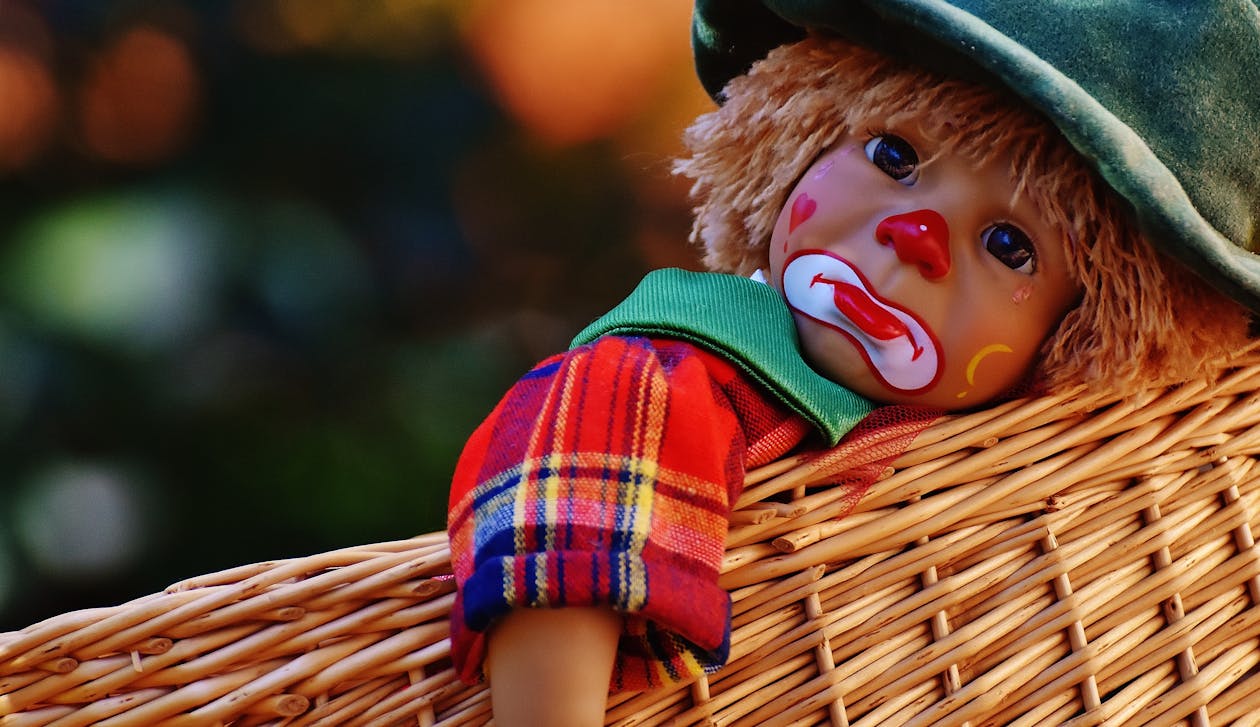 Free Sad Clown Doll in Basket Stock Photo