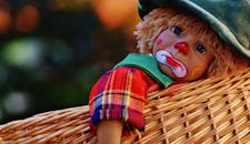 Sad Clown Doll in Basket