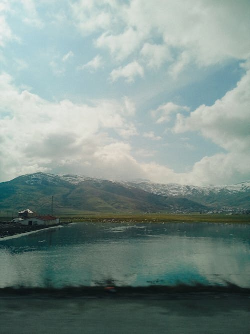 Snowcapped Mountains by the Lake