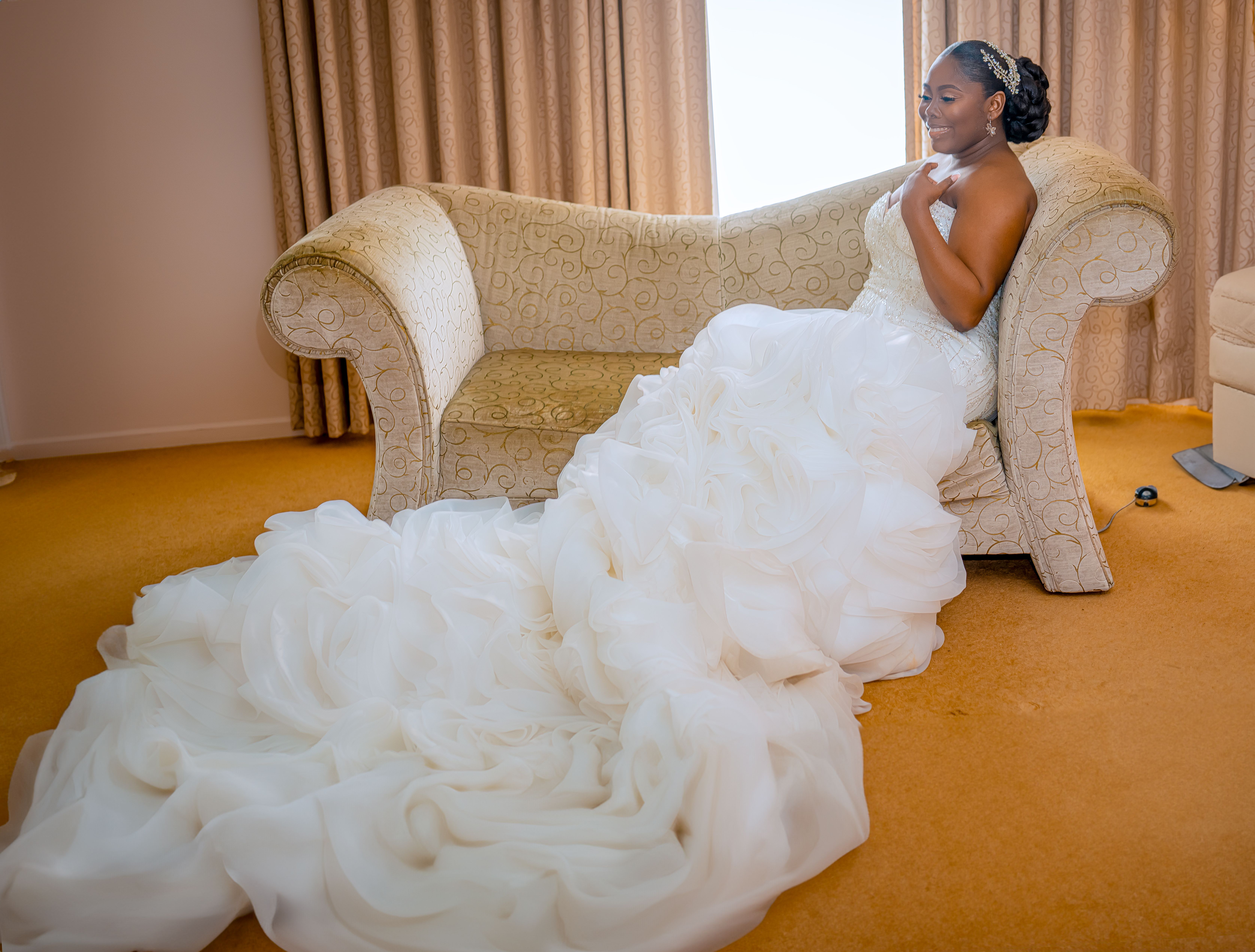 Bride in Wedding Dress Sitting on Sofa · Free Stock Photo