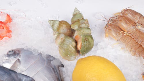 A variety of seafood including shrimp, fish and lemon