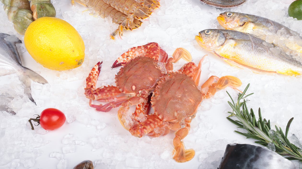 A variety of seafood including crab, fish and vegetables