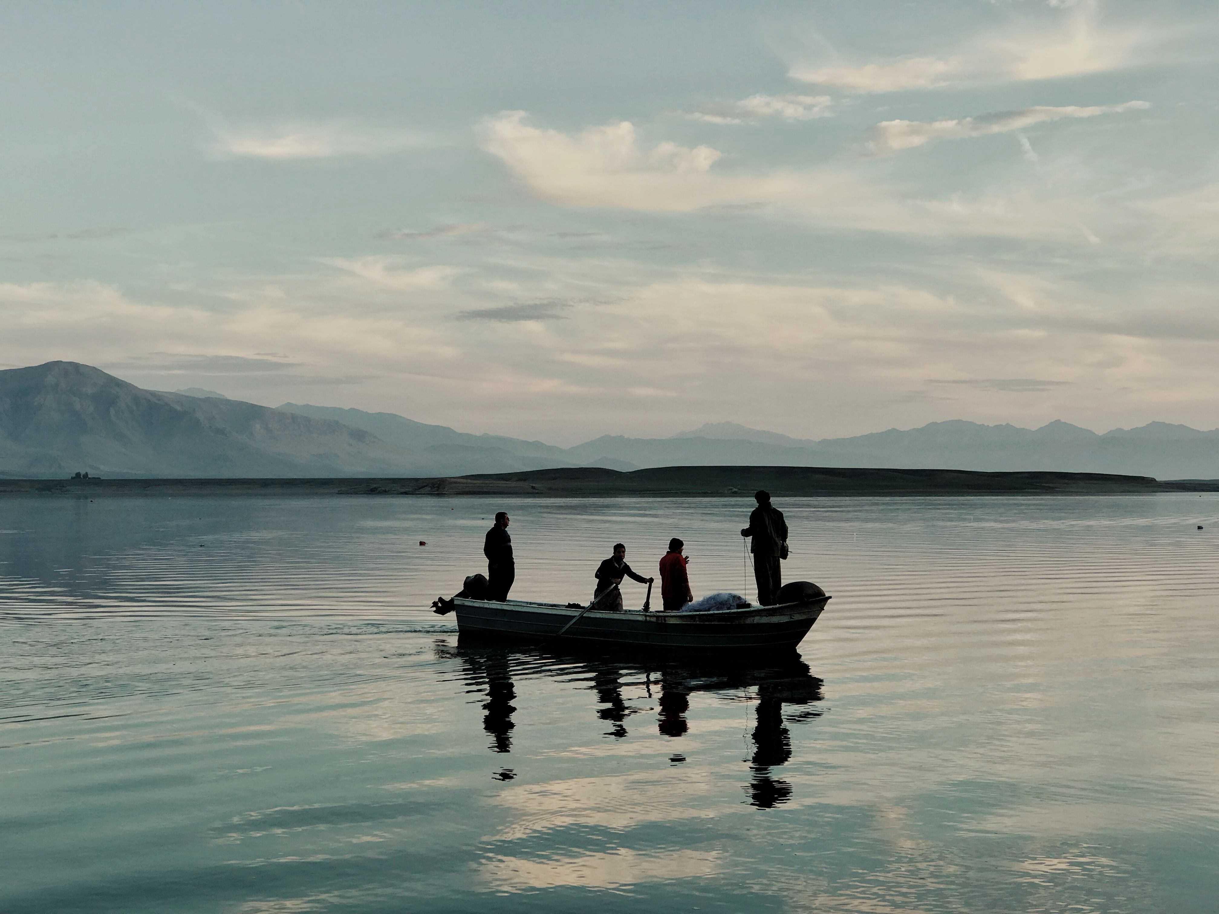 Silhouettes of People On a Boat · Free Stock Photo