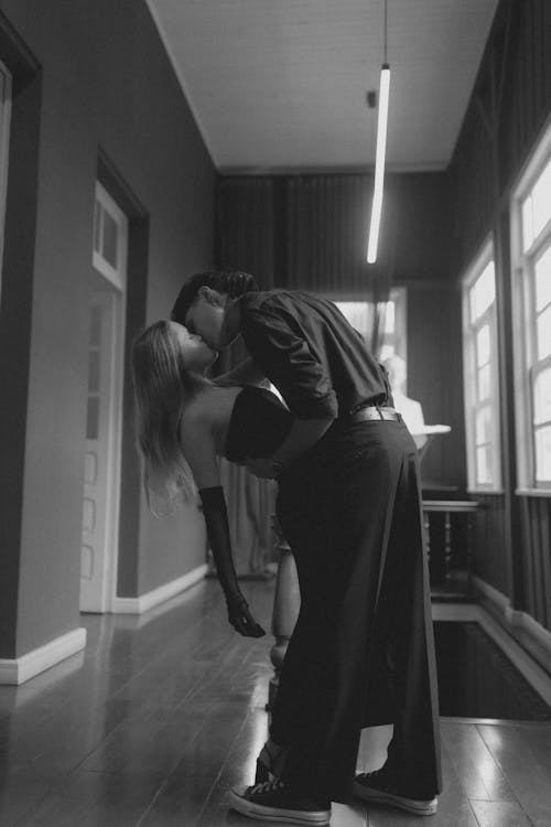 Couple Kissing in a Hall in Black and White 