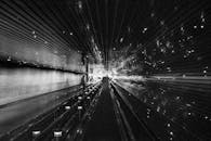 Grayscale Photography of People Walking on Walkalator