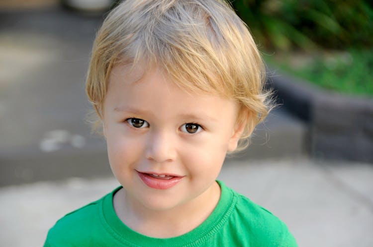 Smiling Boy In Green Crew-neck Top