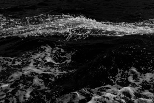 Monochrome image capturing the intense motion of ocean waves with a dramatic effect.