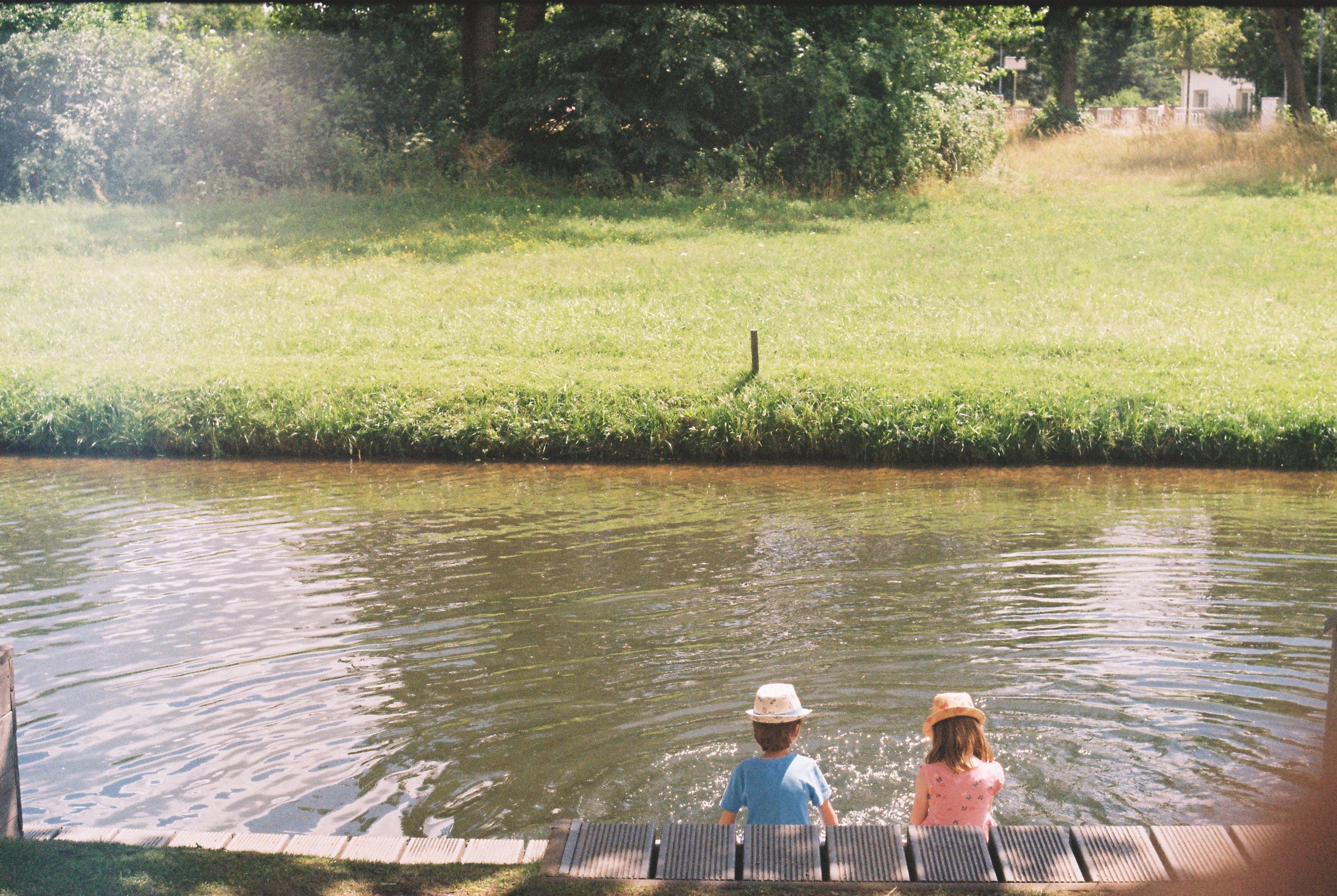 Family enjoying a summer holiday by the river
