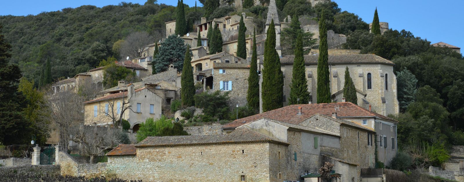 Charming medieval village nestled among hills in La Roque-sur-Cèze, France.