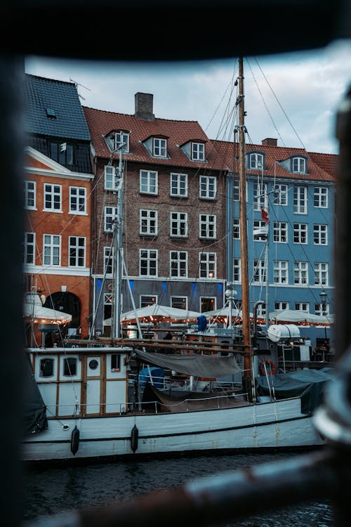 A boat is docked in front of a building