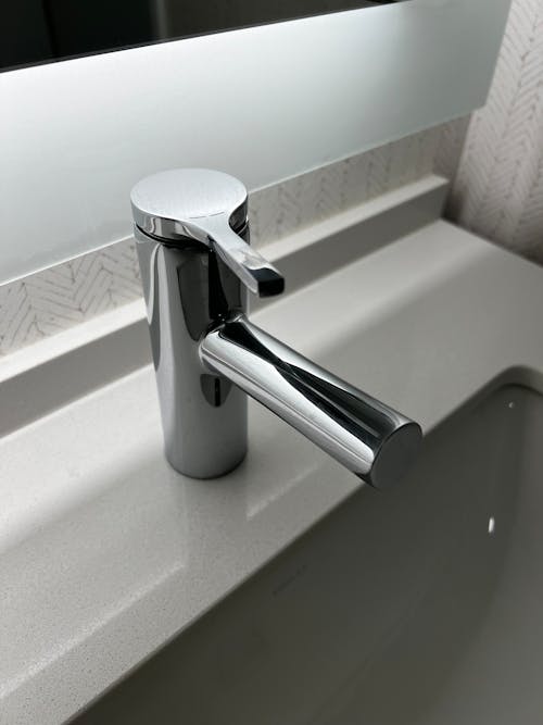 A modern bathroom sink with a chrome faucet