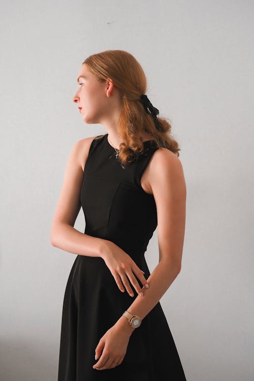 Blonde Woman Posing in Black Dress 